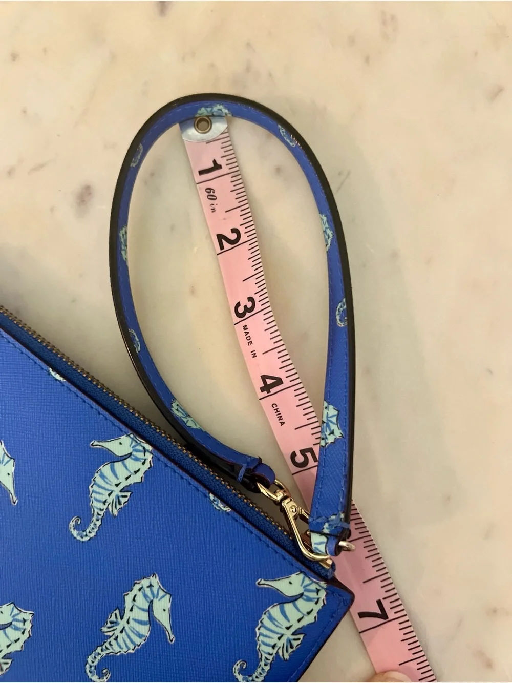 kate spade cobalt blue seahorse wristlet clutch
